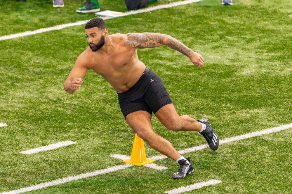 Graduate defensive end Davin Vann performs a cone drill during NC State football's Pro Day in the Close-King Indoor Practice Facility&#160;on Tuesday, March 25, 2025. NC State players performed various tasks in front of NFL scouts before the upcoming draft.