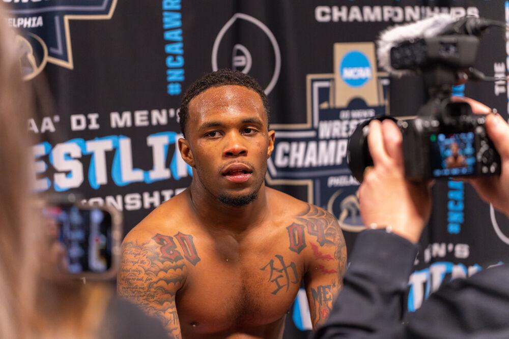 Redshirt freshman Vince Robinson gets interviewed during the NCAA Wrestling Championship Tournament in the Wells Fargo Center on Friday, March 21, 2025.