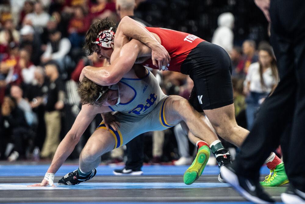 Redshirt junior Isaac Trumble fights for control over his opponent during the second round of the NCAA Wrestling Championship Tournament in the Wells Fargo Center on Thursday, March 20, 2025. Trumble placed fourth for the heavyweight class. NC State placed eighth overall with 46.5 points