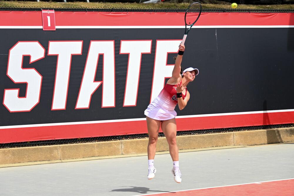 Freshman Michaela Laki serves the ball during her singles match against Georgia Tech at J.W. Isenhour Tennis Center on Sunday, March 30, 2025. Laki won her doubles match 6-2. The Wolfpack beat the Yellow Jackets 4-3.