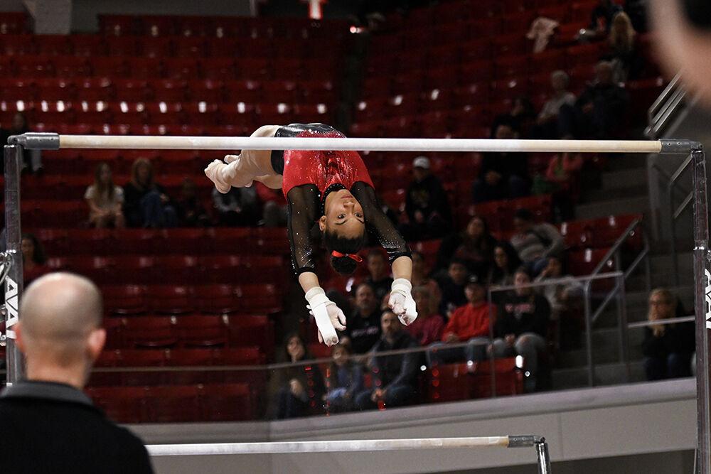 Freshman Ava Myers transitions between uneven bars during the meet against Ohio State in Reynolds Coliseum on Friday, March 7, 2025. Myers scored 9.800 on the uneven bars. NC State beat Ohio State 197.000-196.325.