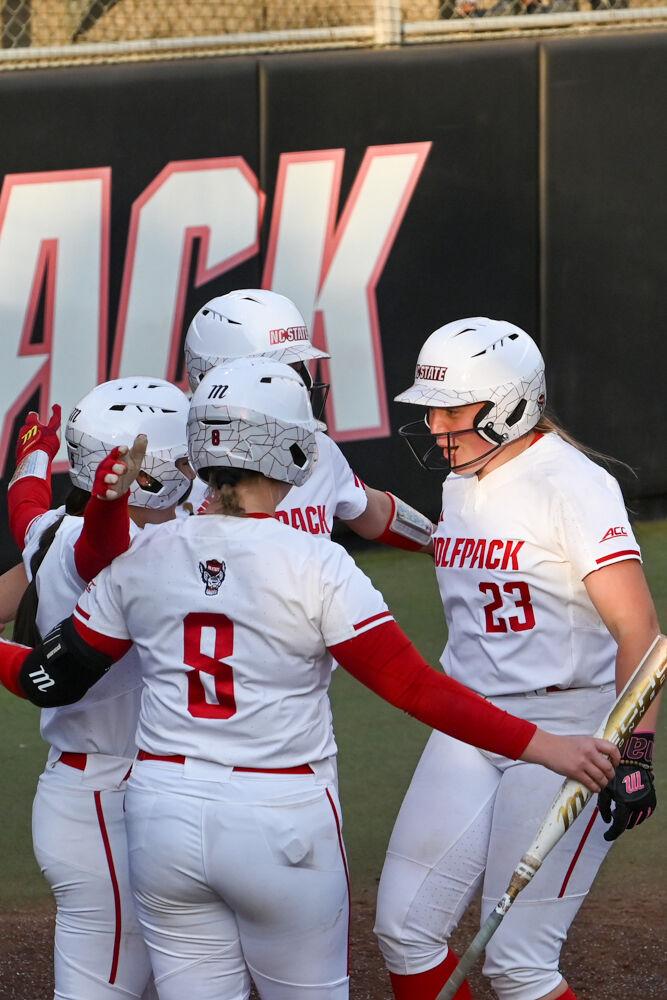 Junior catcher Hannah Church celebrates with teammates after hitting a home run during the game against UNC-Wilmington at Dail Softball Stadium on Saturday, March 1, 2025. Church had four RBIs. The Wolfpack defeated the Seahawks 14-1.
