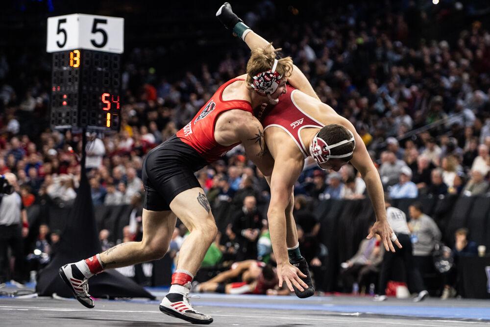 Senior Ed Scott slams his opponent to the mat in the second round of the NCAA Wrestling Championship Tournament in Wells Fargo Center on Thursday, March 20, 2025.&#160;The Wolfpack placed eighth in the tournament with 46.5 points.