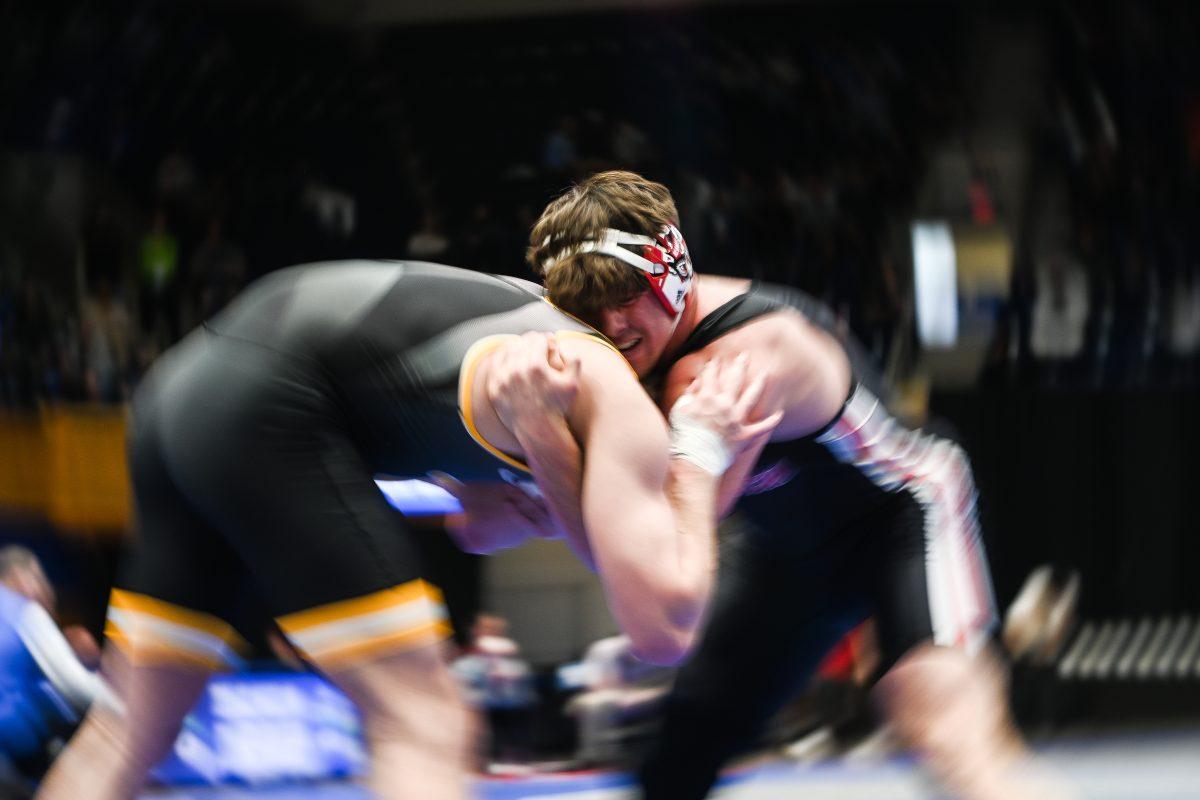 Redshirt junior Isaac Trumble grapples with his opponent during the ACC Wrestling Championship Tournament in Cameron Indoor Stadium on Sunday, March 9, 2025. Trumble placed sixth in the 285 weight class. NC State placed third overall with 62.5 points.