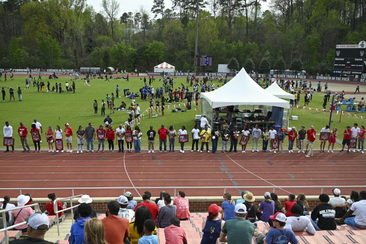 Seniors on the NC State track and field team stand to be recognized during the Raleigh Relays track meet at the Derr Track and Field Facility on Saturday, March 29, 2025.