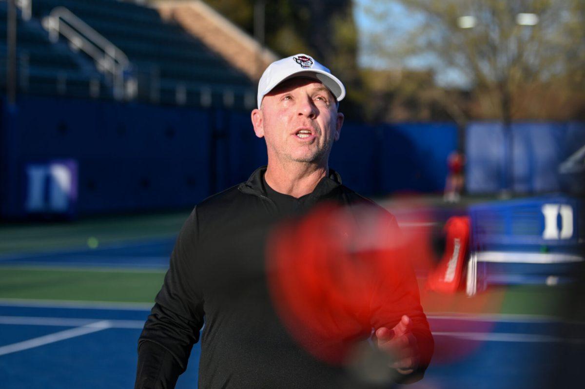 Head coach Simon Earnshaw expresses frustration with the umpire during the match against Duke at Ambler Tennis Stadium on Friday, March 21, 2025. NC State fell to Duke 3-4.