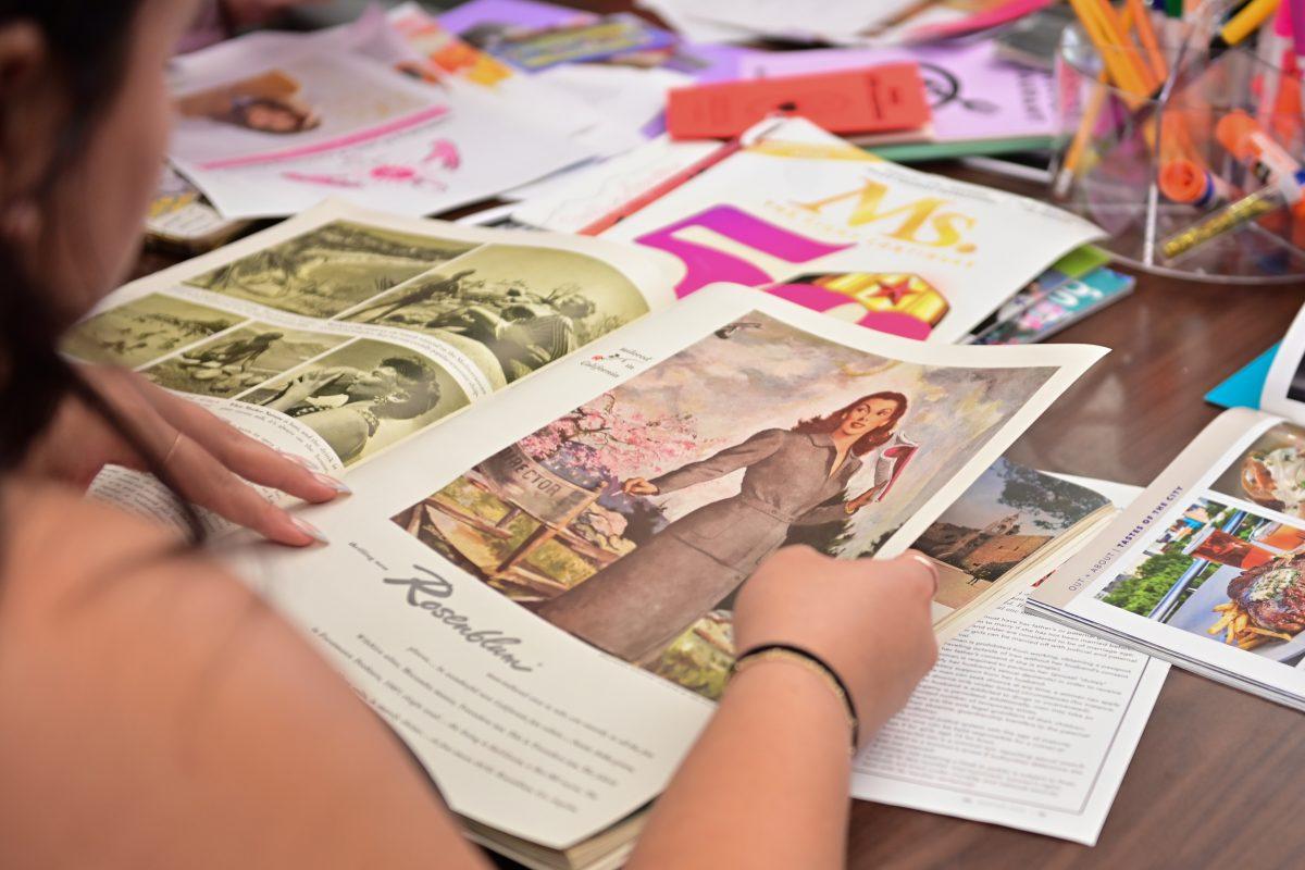 Asher Turner, a second-year student studying psychology, makes a zine at the Womanist History of Scrapbooks and Zines event on Tuesday, March 25, 2025. The Women's center, located on the fifth floor of Talley Student Union, hosted the event.