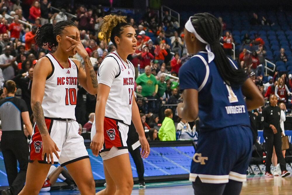 Senior guard Aziaha James (left) and graduate guard Madison Hayes (right) walk off the court during the quarterfinals game of the ACC Tournament against Georgia Tech in Greensboro Coliseum on Friday, March 7, 2025. James led the team in points scored, gaining 16 for the Wolfpack. NC State won the game 73-72.