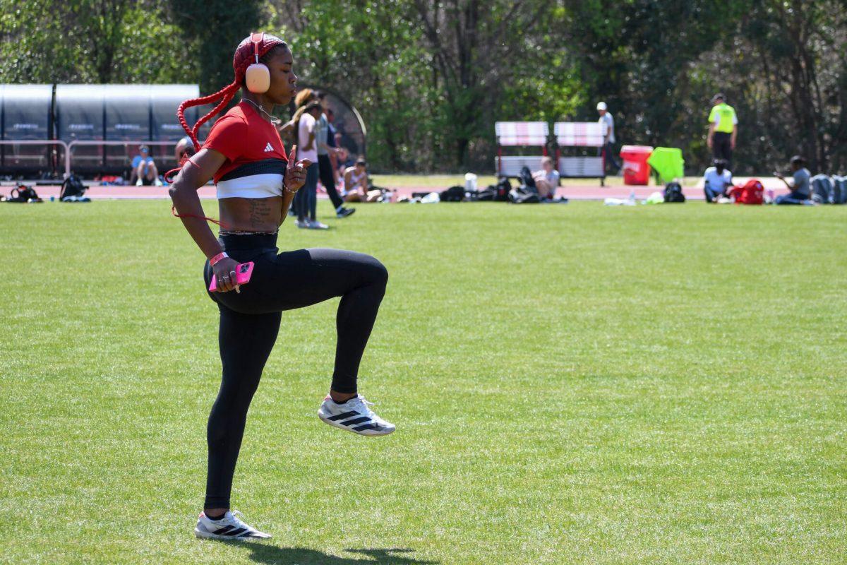 Sophomore sprinter Jordyn Parker warms-up during the Raleigh Relays track meet at the Derr Track and Field Facility on Friday, March 28, 2025. Parker finished second in her heat of the women's 400m with a time of 55.62, also marking a personal best.