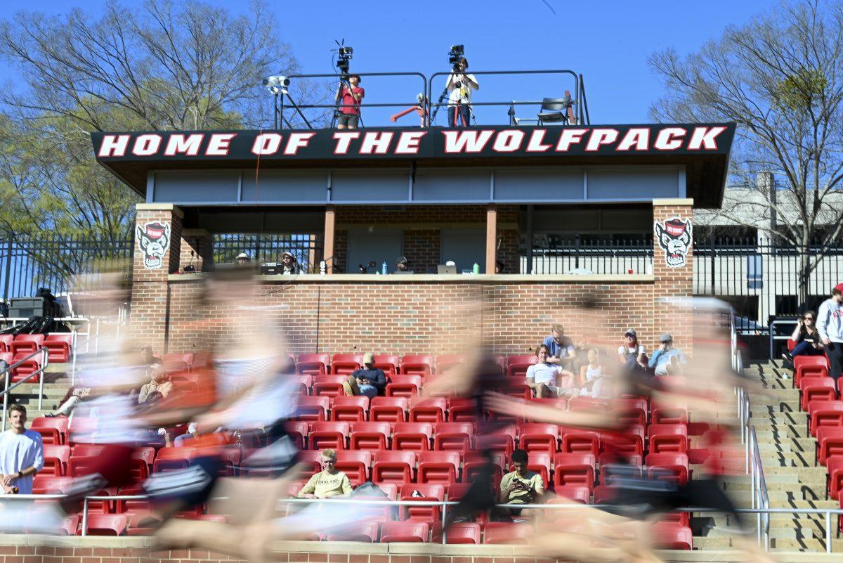 Track athletes run past the stands during the Raleigh Relays track meet at the Derr Track and Field Facility on Thursday, March 27, 2025.