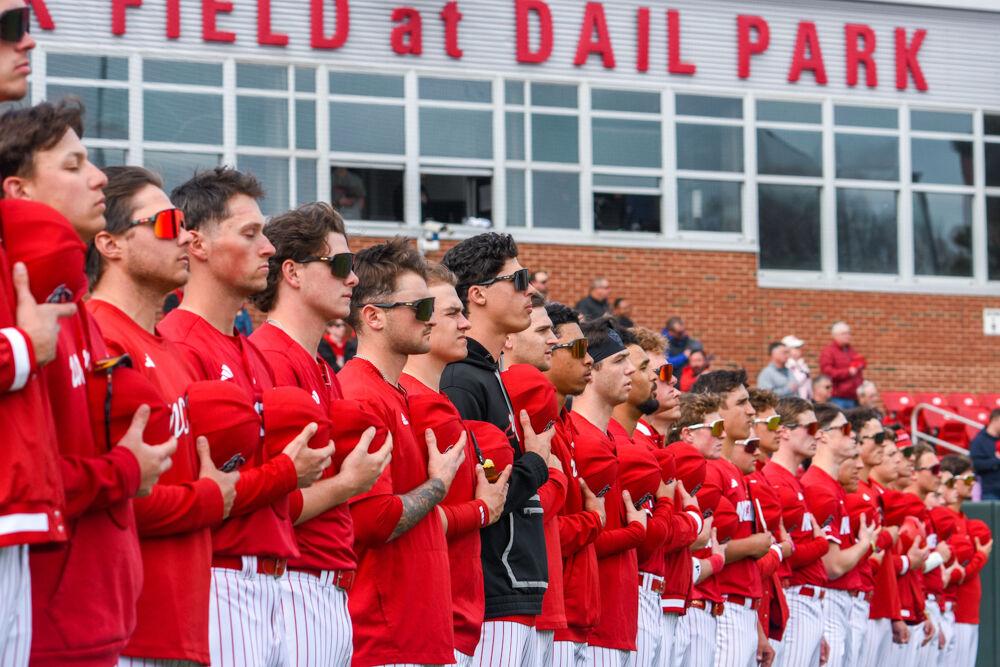 NC State's baseball team stands for the pledge before their game against Wright State&#160;on Doak Field at Dail Park&#160; on Friday, March 7, 2025. NC State continued their five game win-streak. The Wolfpack defeated the Raiders 6-4.