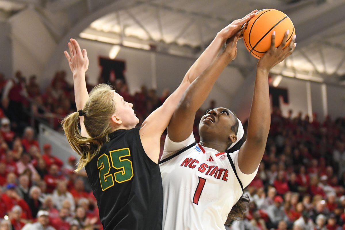 Freshman center Lorena Awou aims for the basket during the first round game of the NCAA Tournament against Vermont in Reynolds Coliseum on Saturday, March 22, 2025. Awou made two rebounds, one assist and one steal. The Wolfpack beat the Catamounts 75-55.