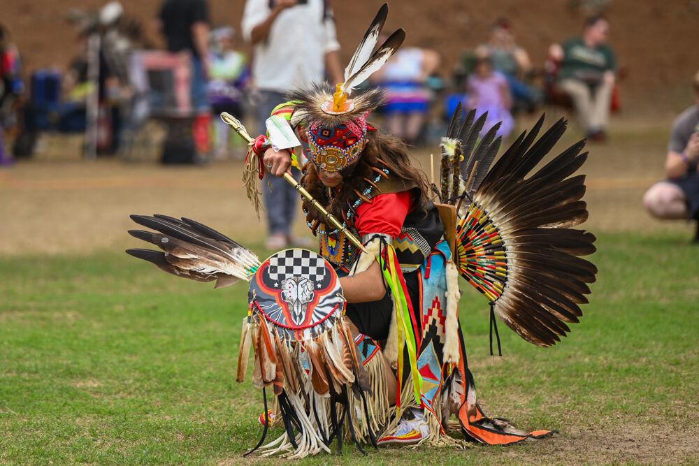 A Native perfomer strikes the finishing pose of his Chicken Dance during NC State's 35th Annual Powwow at Miller Fields on Saturday, April 5, 2025. The event featured a display of different Indigenous dance styles from kids and adults that were accompanied by traditional drum groups.