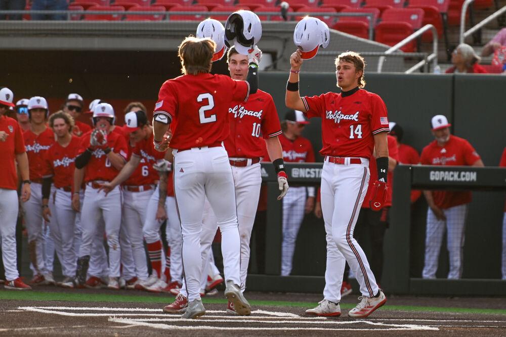 Freshman outfielder Ty Head and sophomore infielder Ryan Jaros celebrate with junior outfielder Brayden Fraasman after his home run during the game against UNC-Greensboro on Doak Field at Dail Park on Tuesday, April 1, 2025. The Wolfpack defeated the Spartans 9-6.