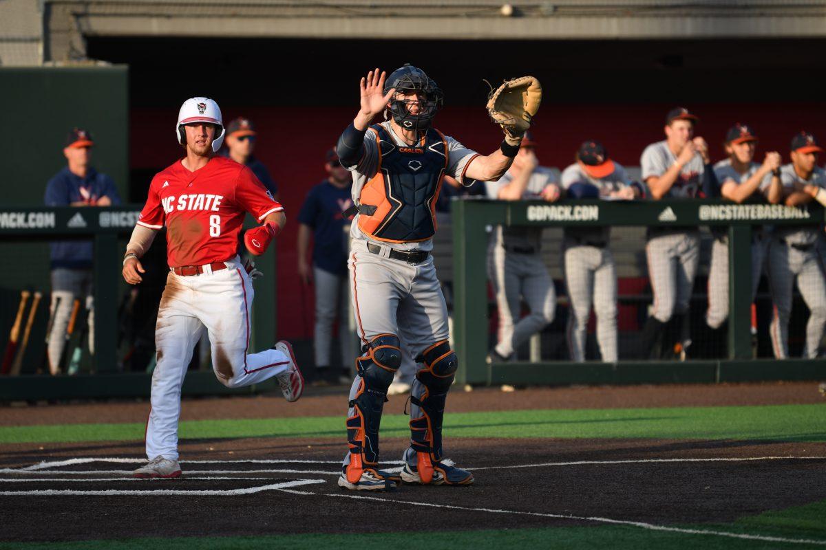 Senior infielder Justin DeCriscio crosses home plate during the Wolfpack's home game against the Virginia Cavaliers on Doak Field at Dail Park on Friday, April 4, 2025. DeCriscio had one hit and scored one run. The Cavaliers defeated the Wolfpack 8-6 to take game one of the weekend series.