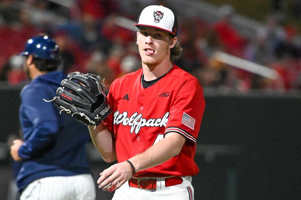 Junior pitcher Andrew Shaffner sticks his tongue out after striking out a batter during the game against UNC-Greensboro on Doak Field at Dail Park on Tuesday, April 1, 2025. The Wolfpack defeated the Spartans 9-6.