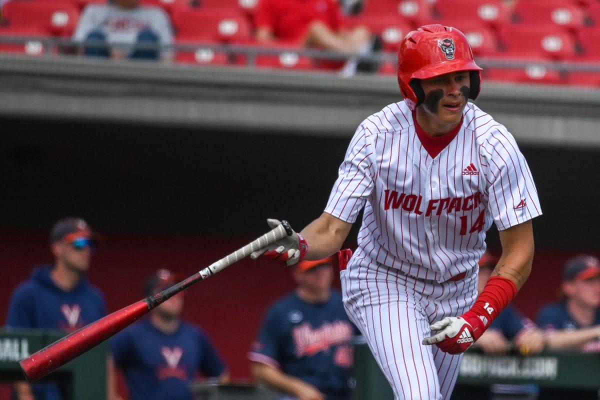 Freshman outfielder Ty Head throws his bat after hitting the ball during the game against Virginia on April 5, 2025 at Doak Field at Dail Park. Head had one hit and two RBIs. NC State bested Virginia 9-2.