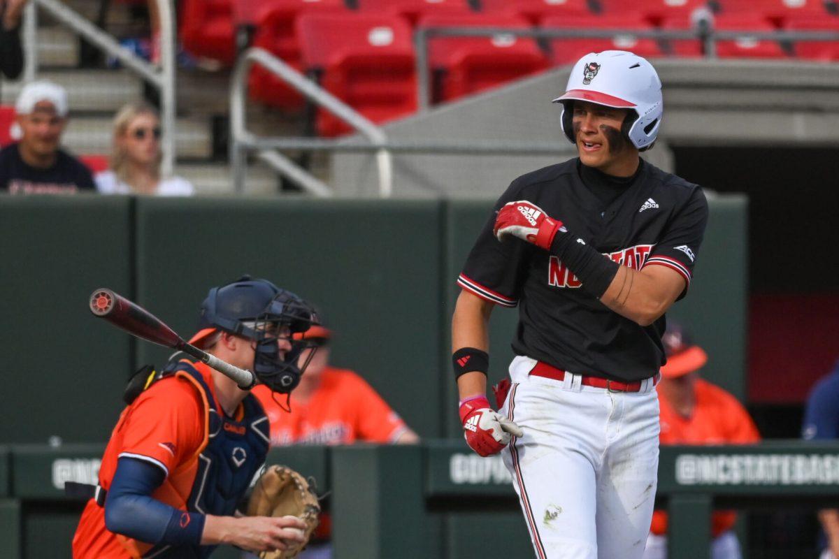 Freshman outfielder Ty Head tosses his bat to first after a long faught at bat to be the tying run on a walk during the game against Virginia on April 6, 2025 at Doak Field at Dail Park. Head had three at bats with one hit and one run. NC State beat Virginia 9-8.