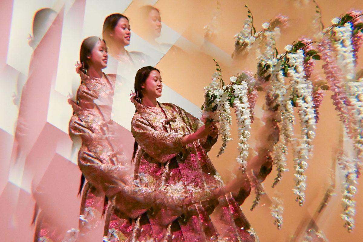 Samantha Shue, a fourth-year studying electrical engineering, smiles while modelling Elle Newkirk's piece from her collection called Palingenesis during Art2Wear: Revive at the Gregg Museum of Art &amp; Design on Thursday, April 24, 2025. Art2Wear is an educational event where students are able to produce wearable art, students work in a studio time throughout the year to produce artwork to be shown during the show.