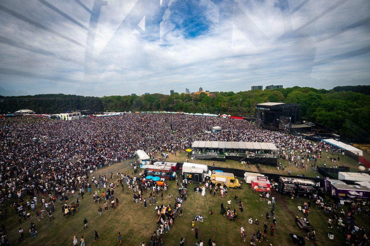 Fans flock to the "Rise" stage to watch Wale perform during the final Dreamville Festival in Dorothea Dix Park on April 6, 2025. Over 50,000 fans attended each day of the festival.