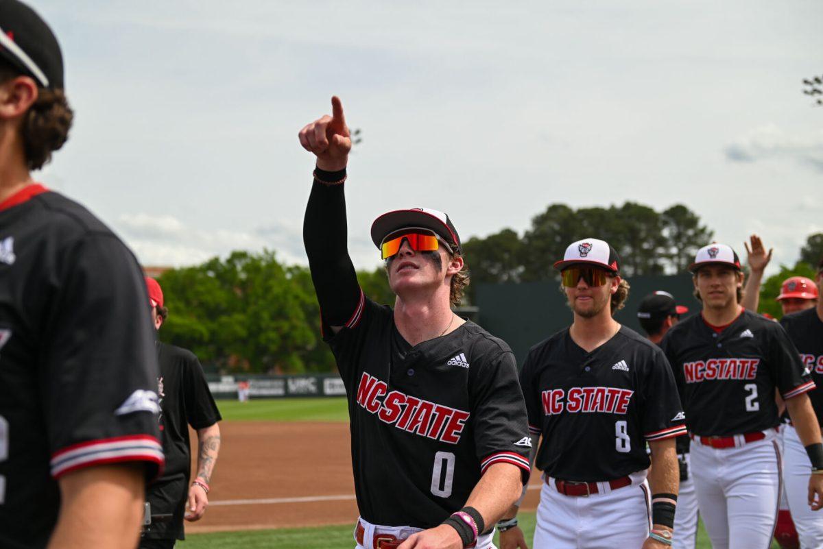 Sophomore infielder Luke Nixon points to the stands before the game against Virginia on April 6, 2025 at Doak Field at Dail Park. Nixon scored one run. NC State beat Virginia 9-8.