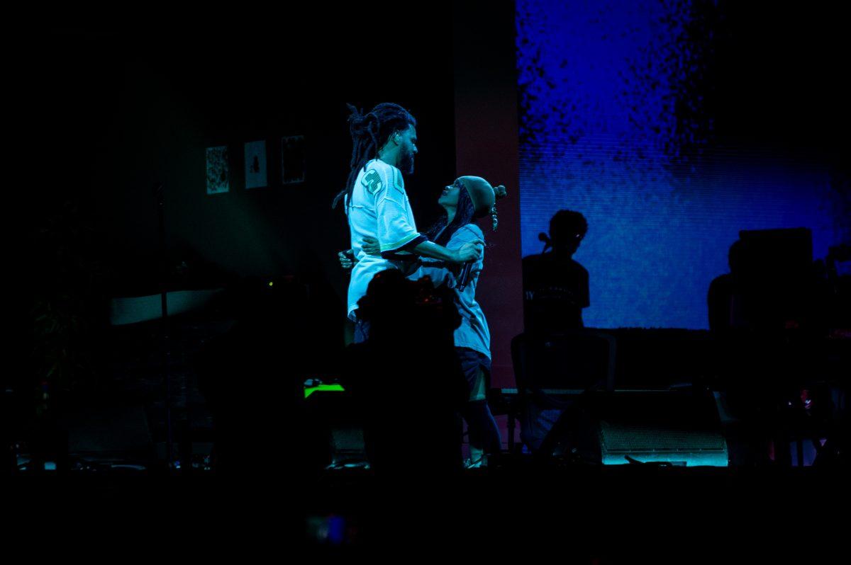 Artists J. Cole and Erykah Badu embrace during the final Dreamville Festival in Dorothea Dix Park on April 6, 2025. Cole and Badu headlined the final day of the festival and performed "Too Deep For The Intro" together.