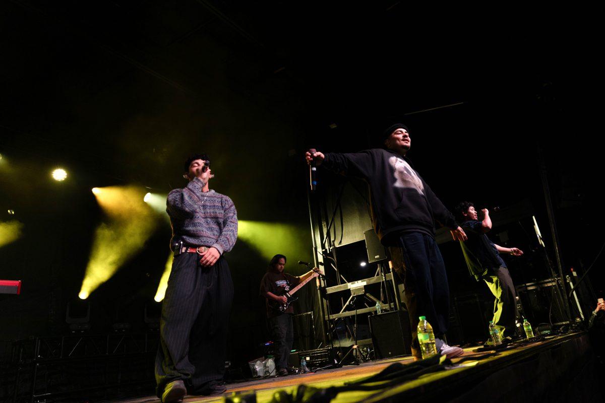 Peach Tree Rascals sings to the crowd during Wolfstock on Miller Fields on Saturday, April 12, 2025. The group is composed of singer-rappers Isaac Pech, Tarrek Abdel-Khaliq and Joseph Barros, producer and mixer Dominic &#8220;Dom&#8221; Pizano and creative director Jorge Olazaba.
