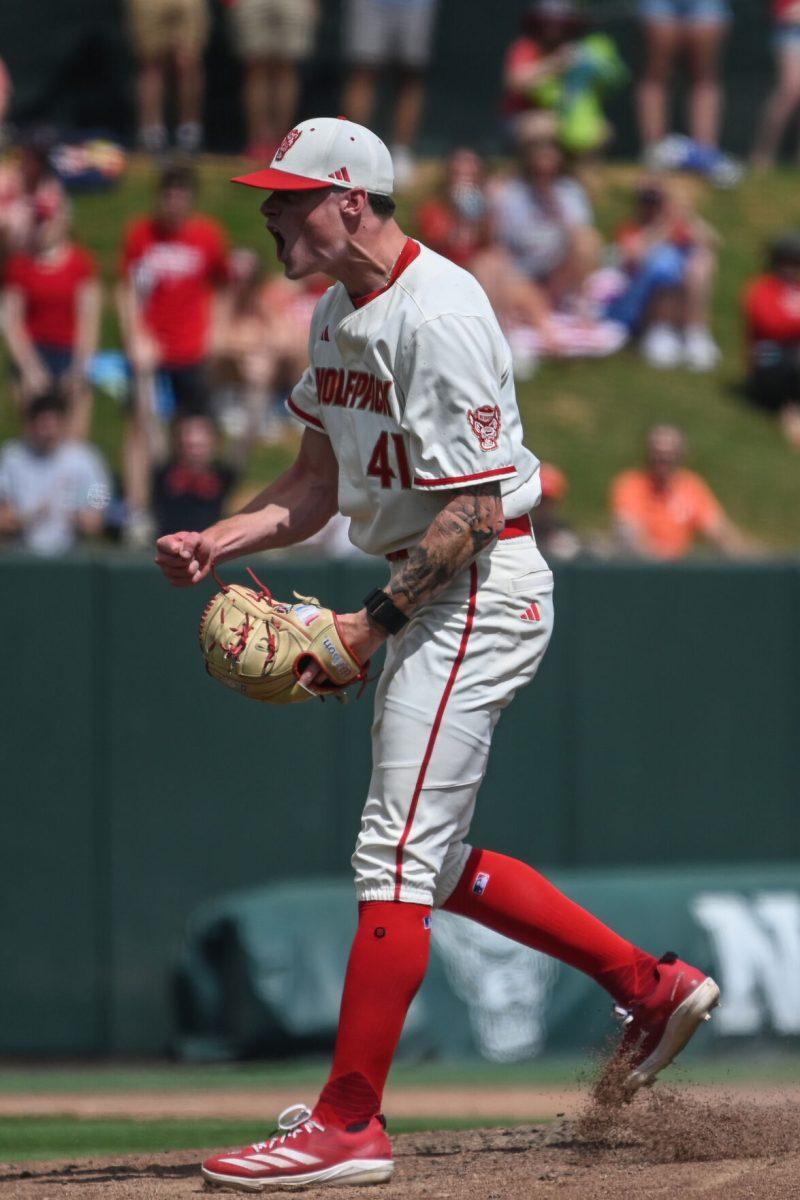 Sophomore pitcher Jacob Dudan celebrates the final out against the Clemson Tigers at Doak Field at Dail Park on Saturday, April 26, 2025. The final game of the series was NC State's second annual Victory Over Cancer game, which raised over $30,000 to support pediatric cancer research. Dudan struck out all three batters faced in the ninth inning in relief of sophomore starting pitcher Ryan Marohn. The Wolfpack beat the number two ranked Tigers 4-1 to complete the sweep.