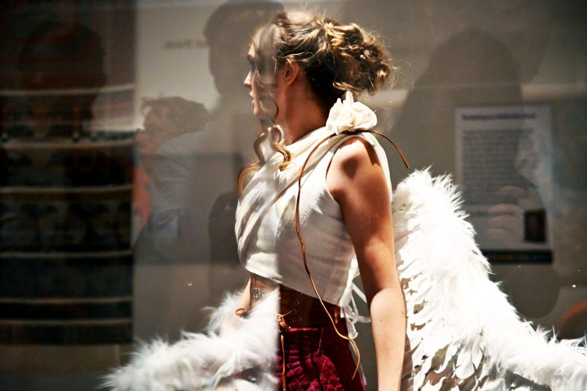Lauren Nance, a second-year studying fashion and textile management, models &#8220;The Fall Of Icarus&#8221; designed by Mia Potter and Devyn Williams during the Art2Wear: Revive! show at the Gregg Museum of Art and Design on Thursday, April 24, 2025. Potter and Williams&#8217; designs were inspired by ancient Greco-Roman art and clothing, as well as medieval garment construction, ballet, and masquerade.