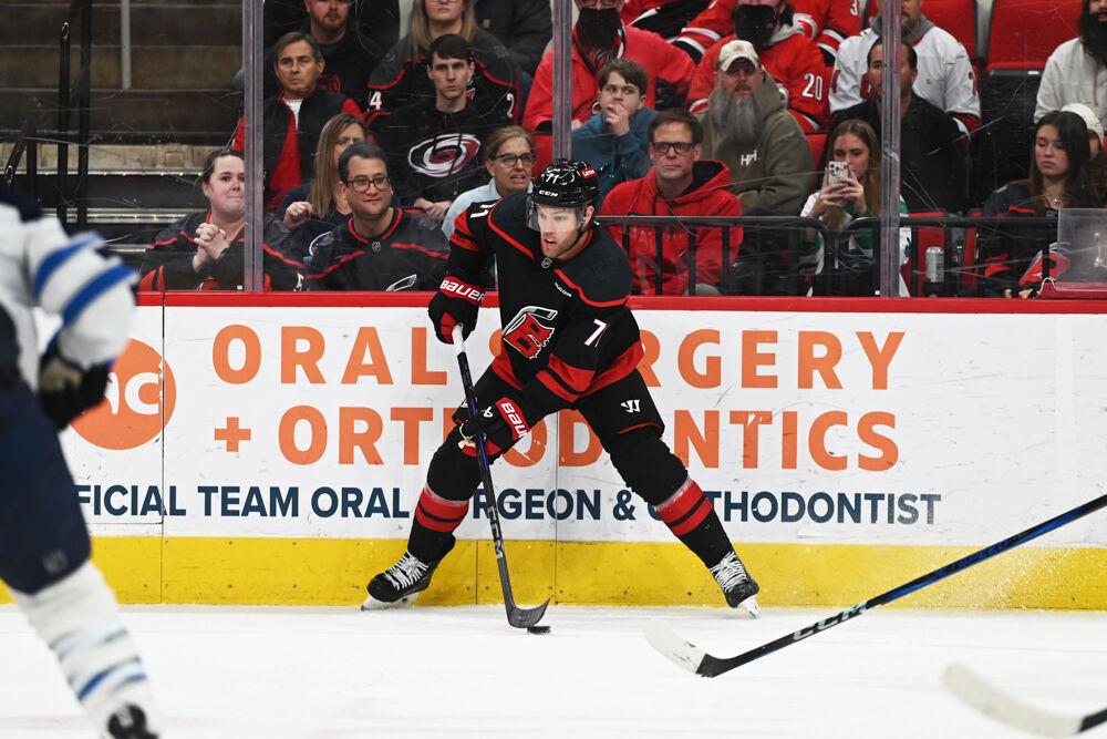 Left wing Taylor Hall passes the puck during the game versus the Winnipeg Jets at the Lenovo Center on Sunday, March 9, 2025. The Hurricanes beat the Jets 4-2.