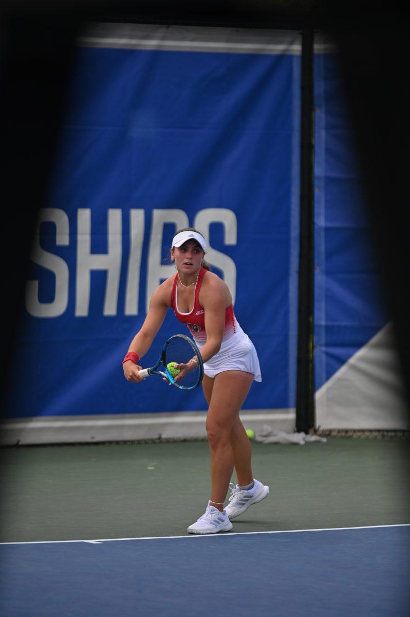 Sophomore Gabriella Broadfoot prepares to serve during the ACC semifinals match against UNC-Chapel Hill at Cary Tennis Park on Saturday, April 19, 2025. The Wolfpack fell to the Tar Heels 4-1.&#160;