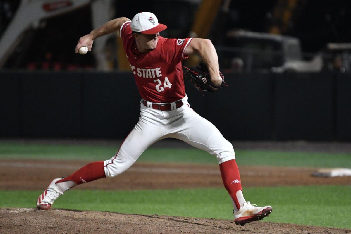 Senior pitcher Carson Kelly pitches during the Wolfpack's home game against the Virginia Cavaliers on Doak Field at Dail Park on Friday, April 4, 2025. Kelly gave up no runs and recorded one strike out on 1.1 innings pitched. The Wolfpack lost to the Cavaliers 8-6 in the opening game of the series.
