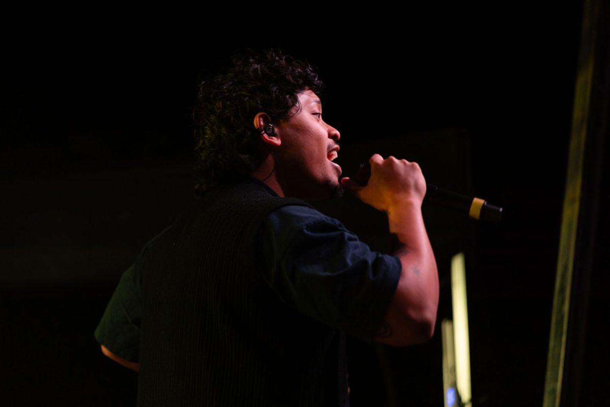 Peach Tree Rascals singer Joseph Barros smiles as he sings to the crowd during Wolfstock on Miller Fields on Saturday, April 12, 2025. Peach Tree Rascals went viral in 2019 for their song "Mariposa".