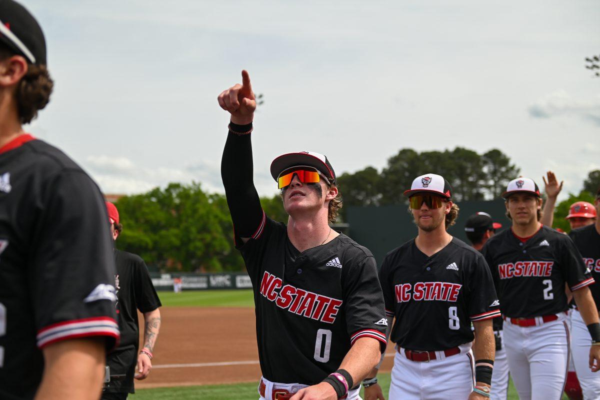 Sophomore infielder Luke Nixon points to the stands before the game against Virginia on April 6, 2025 at Doak Field at Dail Park. Nixon scored one run. NC State beat Virginia 9-8.