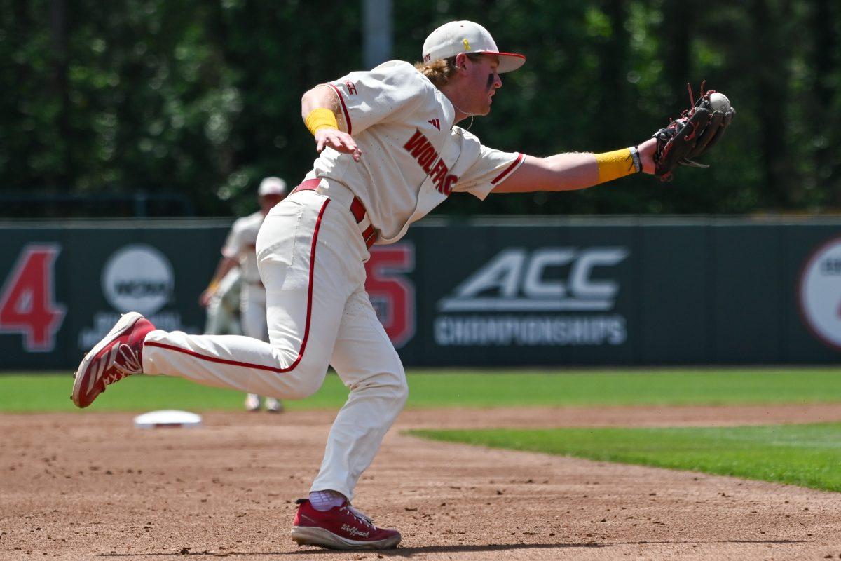 Junior infielder Matt Heavner fields the ball on the run during the game against Clemson at Doak Field at Dail Park on Saturday, April 26, 2025. NC State beat Clemson 4-1.