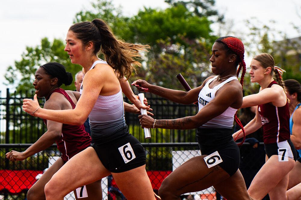 Sophomore sprinter Madison Moraja takes the relay baton from sophomore sprinter Jordyn Parker in the 4x100m relay during the Duke Invitational in the Morris Williams Stadium on Saturday, April 13, 2025. The relay team placed second in their heat and fourth overall with a time of 46.15.