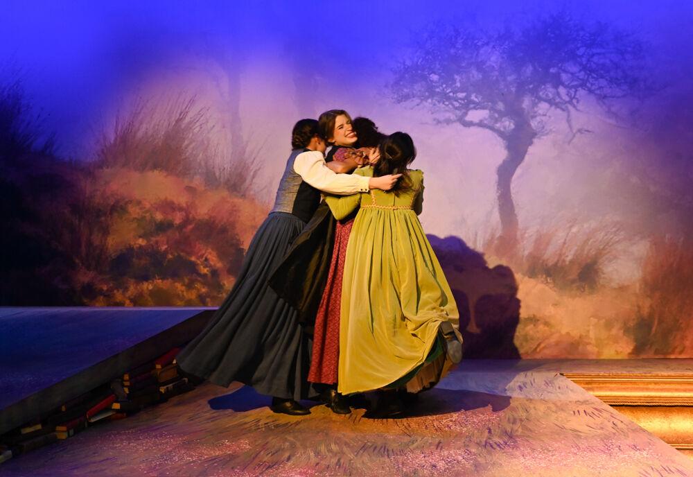 The four main cast members of "You on the Moors Now" embrace with joy during a scene of the play's dress rehearsal at Titmus Theater on Wednesday, April 2, 2025. The musical runs from April 3-13.