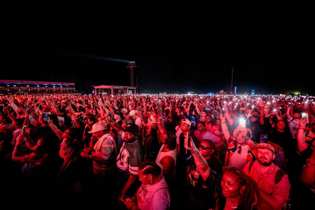 Fans hold up their flashlights during Lil Wayne's performance during the final Dreamville Festival in Dorothea Dix Park on April 5, 2025. Over 50,000 fans attended each day of the festival.