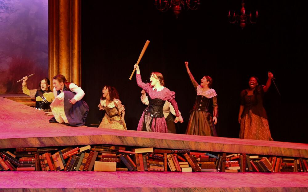 Cast members of "You on the Moors Now" prepare to charge into battle during the play's dress rehearsal at Titmus Theater on Wednesday, April 2, 2025. The play reimagines iconic literary heroines who reject their suitors and band together on the moors, leading to a "battle of the sexes" against their entitled, enraged men.