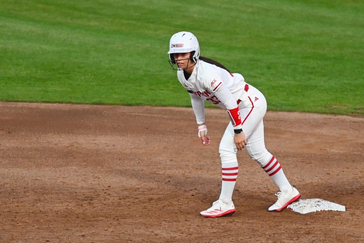 Senior infielder Alaina Smith prepares to sprint to third base during the game against Virginia Tech at Dail Softball Stadium on Friday, April 5, 2025. The Wolfpack lost to the Hokies 10-2.
