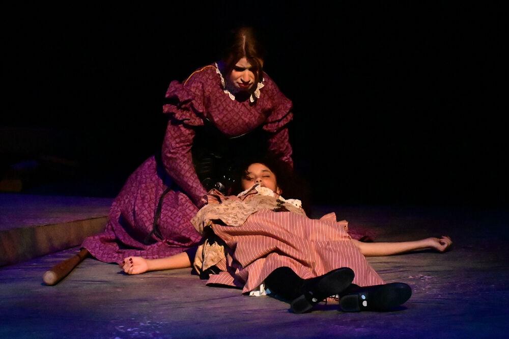 Quinn Kinser, as Jane, holds Jayla Freeman, as Cathy, during the dress rehearsal performance of "You on the Moors" at Frank Thompson Hall on Wednesday, April 2, 2025. "You on the Moors Now" reimagines classic literary heroines as they explore themes of love, betrayal and independence.