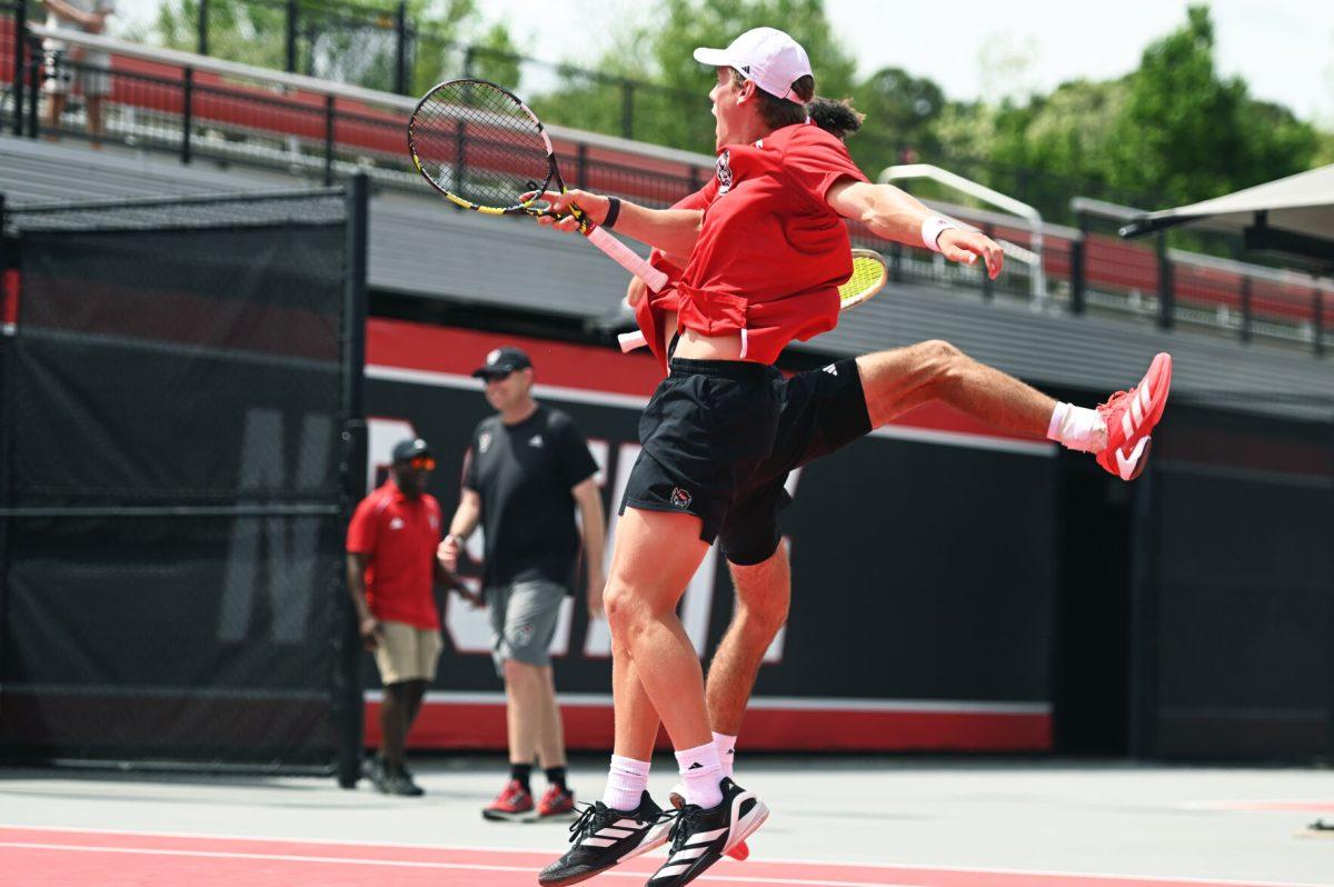 Seniors Braden Shick and Fons Van Sambeek celebrate after winning their doubles match versus SMU at J.W. Isenhour Tennis Center on Sunday, April 6, 2025. Shick and Van Sambeek won their doubles match 7-6. The Wolfpack beat the Mustangs 4-1.