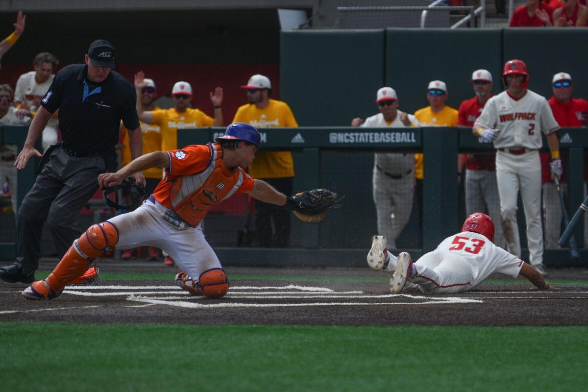 Sophomore outfielder Jet Gilliam slides into home plate before the tag from the Clemson catcher during the Wolfpack's third game against the Tigers on Doak Field at Dail Park on April 26, 2025. Gilliam came in to pinch run for junior outfielder Josh Hogue after Hogue hit a double. The Wolfpack beat the Tigers 4-1 to complete the series sweep on the number two ranked opponents.