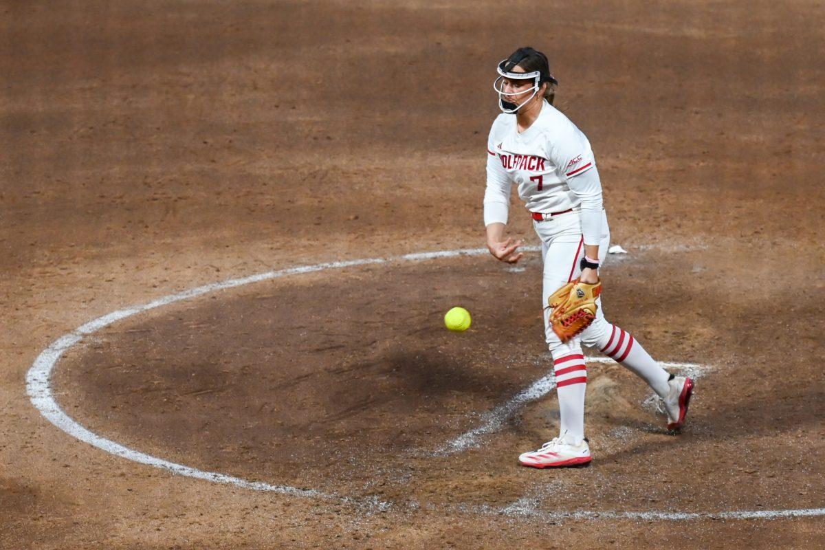 Junior pitcher Wynne Gore hurls the ball during the game against Virginia Tech at Dail Softball Stadium on Friday, April 5, 2025. Gore only pitched 0.1 innings. The Wolfpack lost to the Hokies 10-2.