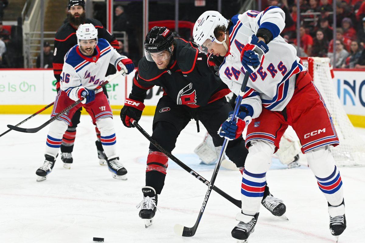 Center Mark Jankowski battles an opponent for the puck during the game versus the New York Rangers at the Lenovo Center on Saturday, April 12, 2025. Jankowski scored one goal for the Hurricanes. The Hurricanes beat the Rangers 7-3.