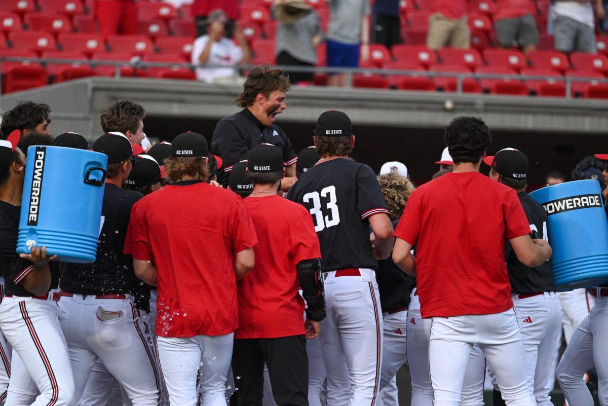 NC State baseball team celebrates after walkoff home run by Josh Hogue during the game against Virginia on April 6, 2025 at Doak Field at Dail Park. NC State beat Virginia 9-8.