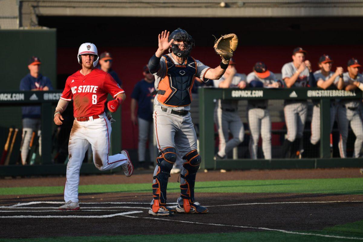 Senior infielder Justin DeCriscio crosses home plate during the Wolfpack's home game against the Virginia Cavaliers on Doak Field at Dail Park on Friday, April 4, 2025. DeCriscio had one hit and scored one run. The Cavaliers defeated the Wolfpack 8-6 to take game one of the weekend series.