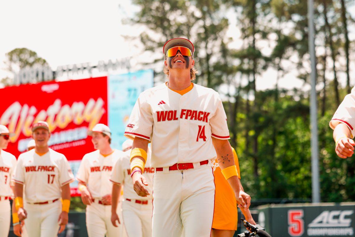 Freshman outfielder Ty Head smiles while walking to the dugout before the 2nd annual "Victory over Cancer" game at Doak Field at Dail Park on Sunday, April, 27, 2025. Head is batting .271 this season. NC State beat Clemson 4-1.