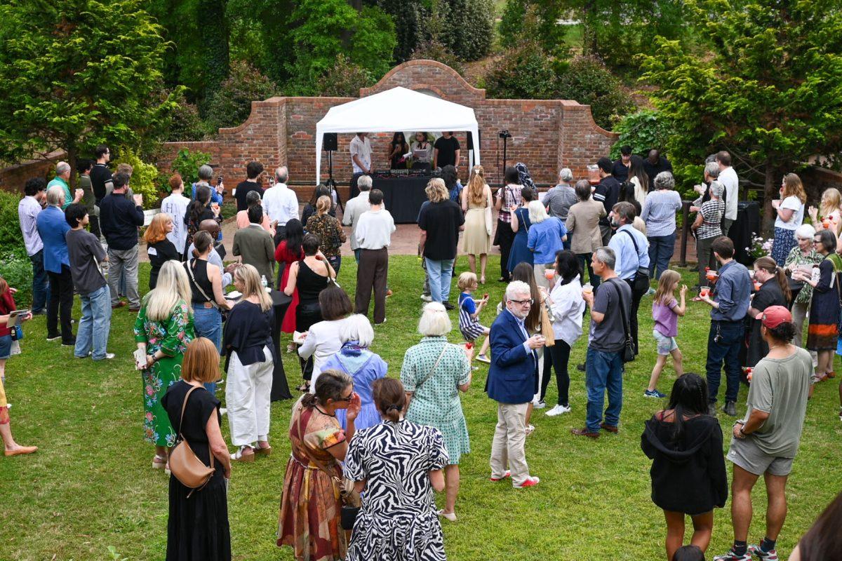 Audience members gather in the garden for a post-show chat during Art2Wear: Revive at the Gregg Museum of Art &amp; Design on Thursday, April 25, 2025. Instead of a traditional fashion runway, Art2Wear displayed the wearable artwork through performance art done by the artists and models.