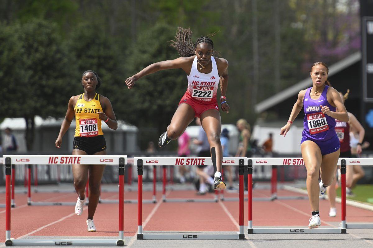 Freshman sprinter Hannah Komukyeya scales over the hurdle during the Raleigh Relays track meet at the Derr Track and Field Facility on Saturday, March 29, 2025. Komukyeya came in third in her 400m hurdle heat with a time of 1:05.51.